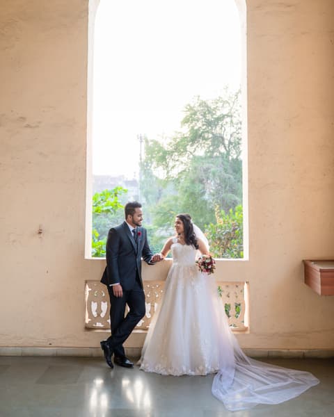 Couple in a sunlit arched window